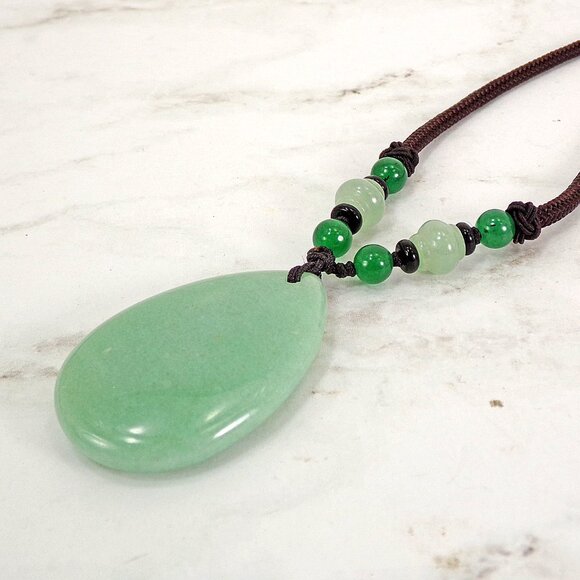 Large green aventurine stone pendant necklace in a teardrop shape on brown cord - Picture 7 of 9